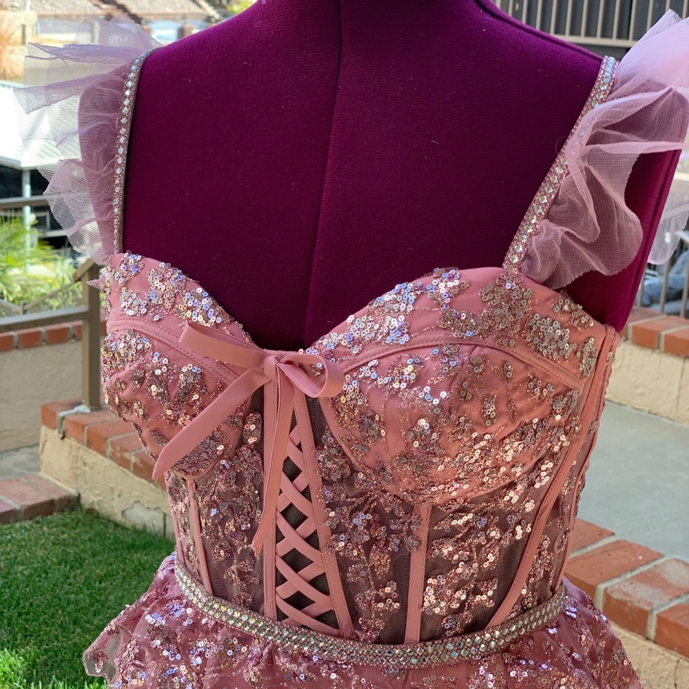 Glitter Mesh Corset Tiered Ballgown with Sequin and Ruffle Detail.
Prom dress.